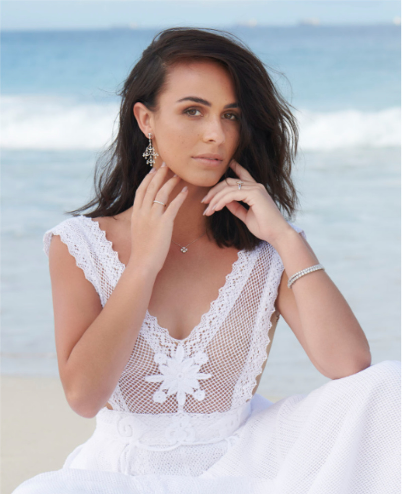 A model wearing engagement and wedding rings